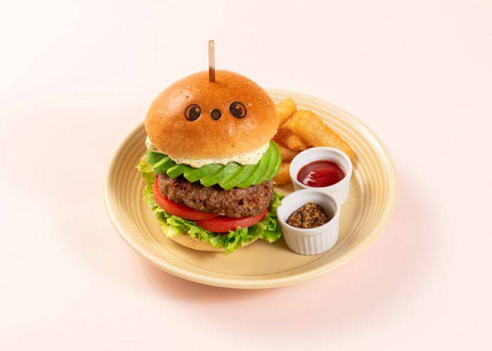 The LOVOT Cafe burger, with its brioche bun stamped with the cute face of a LOVOT doll.